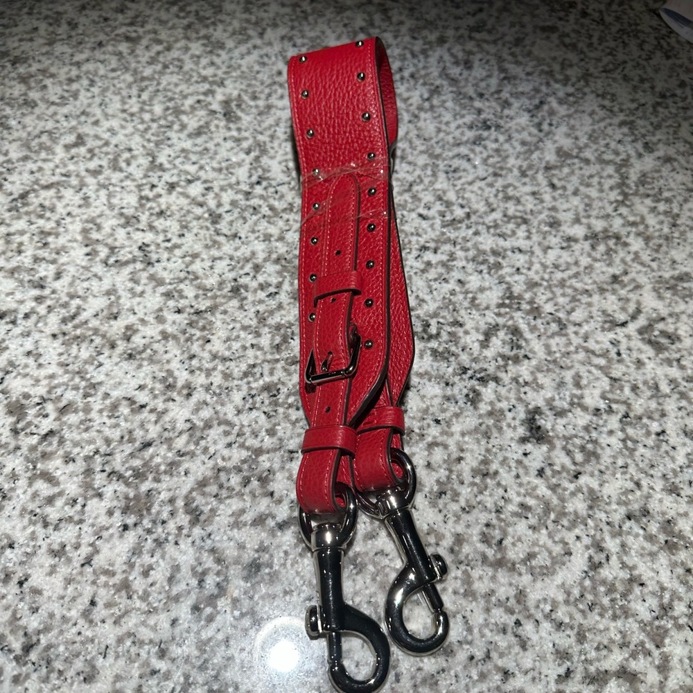 Red leather shoulder bag strap
